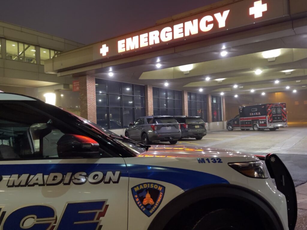 Photo of a Madison Police squad parked in front of a hospital emergency room